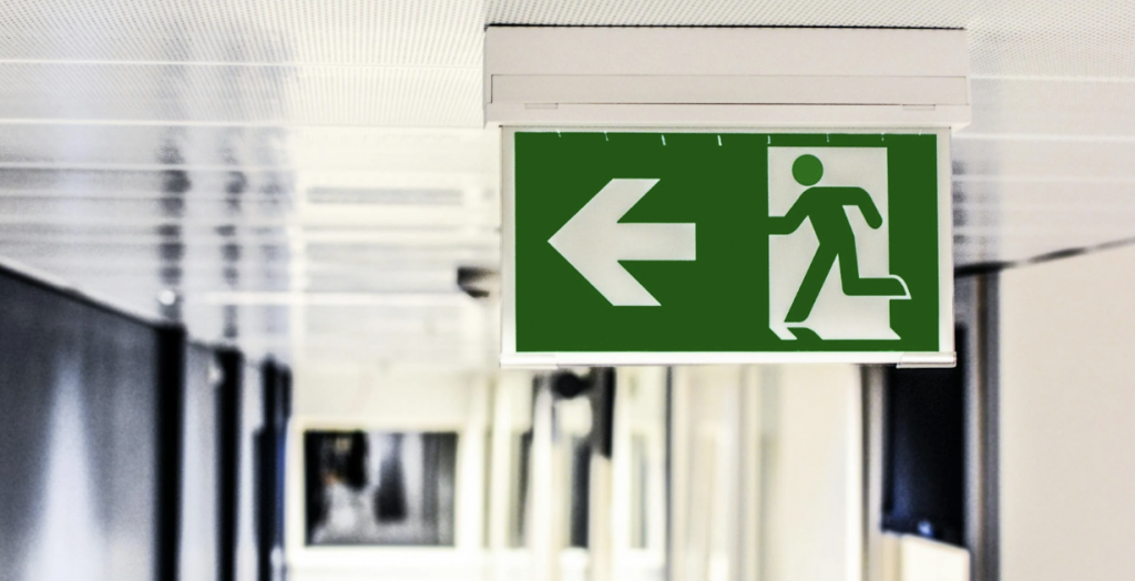 Green and White European Exit Sign